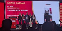 purina team accepting an award on stage