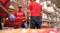 A group of Purina employees in a warehouse