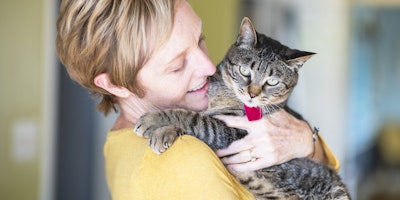 woman holding a cat