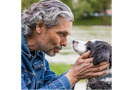 Owner having a chat with his dog