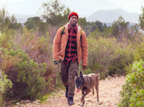 Man hiking with his dog